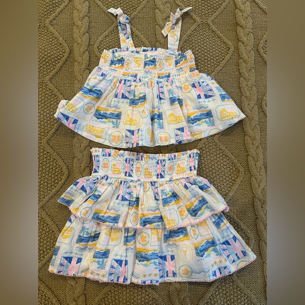 Haute Hippie 2 Piece
Smocked Tank/Ruffled Skirt
Multi Colored Print Coord Set